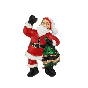 Broche Père Noël en émail festif rouge et blanc avec un sac de cadeaux vert