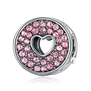 Polished silver charm with pink zircon stones and hollow heart-shaped center design