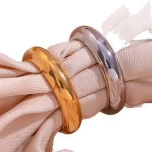 Minimalist 18K gold and silver plated stainless steel chunky rings on pink satin fabric