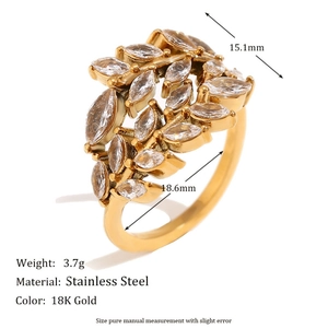 Anillo abierto de acero inoxidable bañado en oro de 18K con diseño de rama y circón