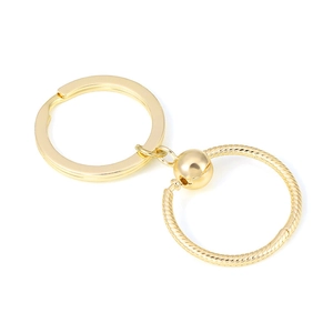 Golden snake chain style metal keychain with round ring and polished metal ball detail