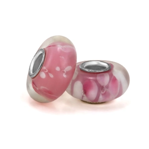 Pink handmade Murano glass beads with white floral patterns and silver metal core