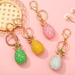 Chic pineapple keychains with sparkling rhinestones in four colors and gold hardware