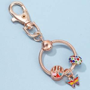 Rose gold lobster clasp keychain with colorful butterfly charms and pavé crystal beads
