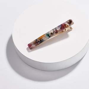 Multicolor resin rectangular hair clip with golden metal crocodile base on stand