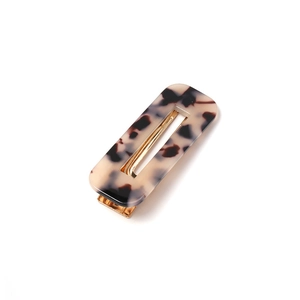 Classic tortoise shell acrylic hair clip with rectangular hollow design and gold metal base