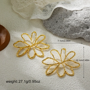 Detailed view of oversized 18K gold-plated sunflower earrings with 7.1cm width dimensions