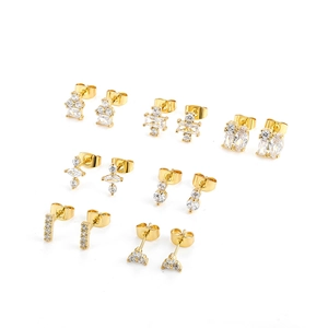 Detailed close-up of 8 pairs gold geometric 18K square zircon stud earrings set