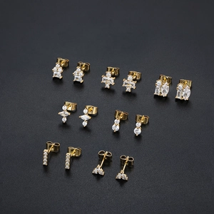 Detailed set of six 18K gold-plated stud earrings featuring white cubic zirconia designs