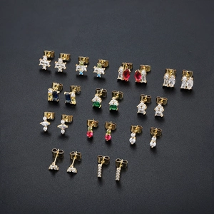 Detailed set of ten pairs of 18K gold plated stud earrings with colorful zirconia gems