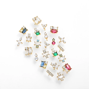 Detailed close-up of 18K gold earrings collection with colorful cubic zirconia stones