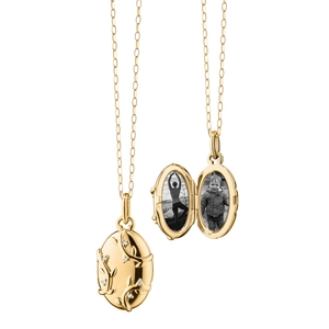 Detail of 18K gold locket necklace showing vine texture and interior photo compartment