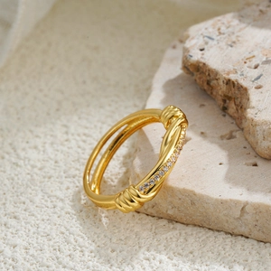 18K gold-plated knotted zircon ring featuring a double-band twisted design and pavé stones