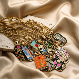 Macro view of colorful tarot pendants with gold plating and drip oil craft on stone