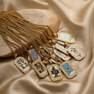 Detail of tarot card necklaces with colorful enamel icons and rhinestone borders