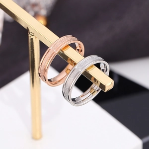 Minimalist matte finish stainless steel couple rings in rose gold and silver colors