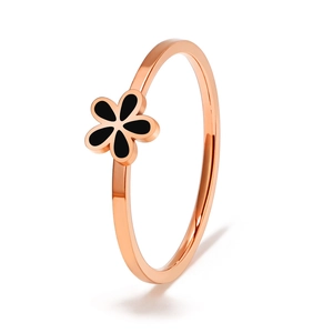 Elegant rose gold titanium ring with black and white daisy flower design for women