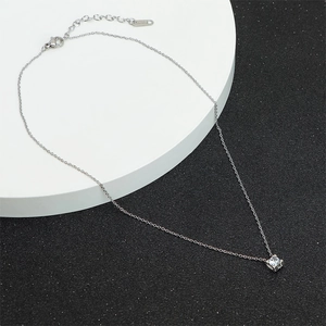 Minimalist silver-toned necklace featuring a square zircon pendant and 18k rose gold plating
