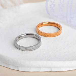 Polished titanium steel couple rings set with Forever Love engraving and zircon heart