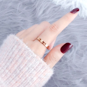 Rose gold titanium steel heart ring engraved with Forever Love on finger