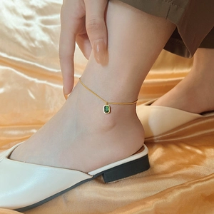 Vintage 18K gold plated titanium anklet featuring a rectangular green crystal pendant