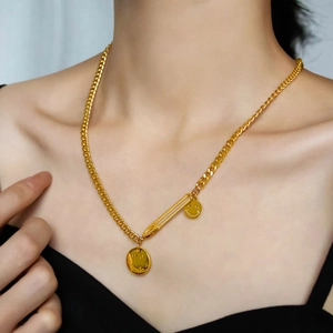 Golden Cuban chain necklace with safety pin detail and smiley face pendants