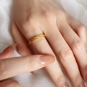 Minimalist gold titanium steel ring featuring I FEEL YOU EVEN engraving on hand