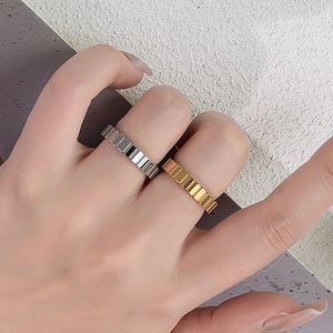 Minimalist stackable geometric ring in gold and silver finish with ice cube texture