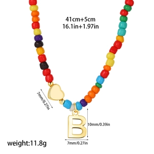 Detail of colorful beaded necklace with 14k gold heart and letter B pendant size guide