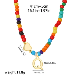 Detail of colorful beaded necklace with 14k gold heart and letter Q pendant size specs