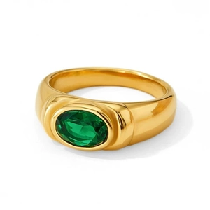 Polished 18K gold ring with a large oval green emerald zircon in a bezel setting