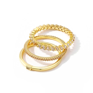 Set of four 18K gold plated stackable rings with sparkling zircon crystals and wave textures
