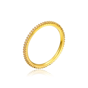 Macro shot of 18K gold ring with pave set cubic zirconia stones on white background
