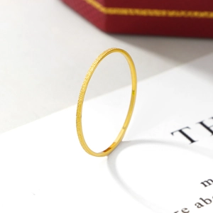 Minimalist gold frosted titanium steel thin ring on white card with jewelry box