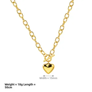 Detail of chunky gold chain necklace with toggle clasp heart pendant and size specs