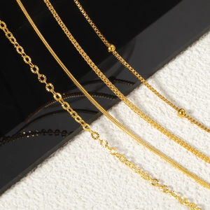 Set of four 24K gold plated titanium steel necklaces with diverse elegant chain patterns