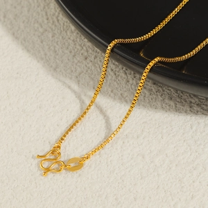 Detailed close-up of 24K gold-plated box chain with secure M-clasp closure for women