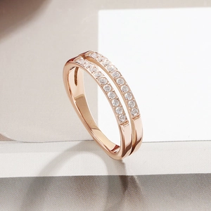 Close-up of double-layer rose gold ring with two rows of micro-pave zircons