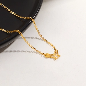 Detailed close-up of 24K gold plated titanium O-chain with a classic S-hook clasp