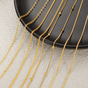 Various 24K gold plated titanium steel necklaces including snake and wheat chain styles