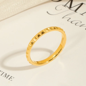 Detailed macro shot of 18K gold plated ring featuring geometric pyramid stud textures