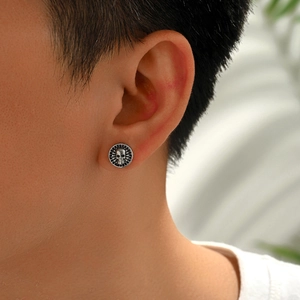 Retro punk skull stud earrings for men in oxidized silver finish with round grainy texture