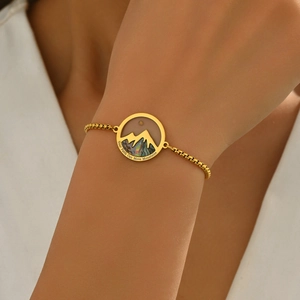 Gold box chain bracelet with mountain pendant and Your Faith Can Move Mountains text
