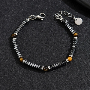 Detailed macro of vintage beaded bracelet with tiger eye stones and hematite beads