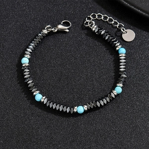 Close-up of hematite beads and blue stones with lobster clasp and metal tag