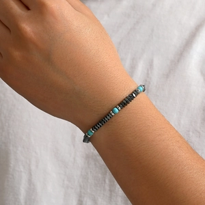 Retro mens bracelet with dark grey faceted hematite and blue turquoise beads on wrist