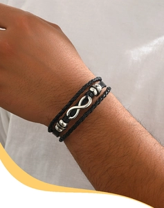 Close-up of men's multilayer braided leather bracelet with silver infinity symbol