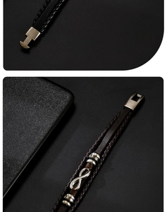 Detail of multi-layer black braided leather bracelet featuring a silver infinity charm