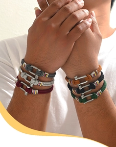 Close-up of multicolored braided nylon cord bracelets with silver horseshoe U-buckles