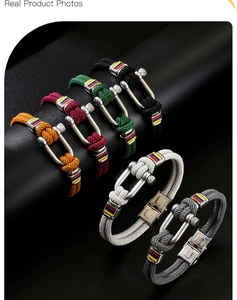 Detailed view of multi-color woven bracelets with U-shaped magnetic metal clasps
